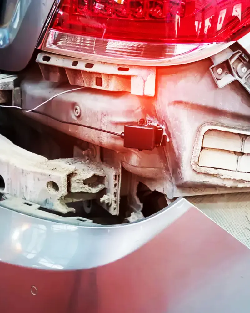 Damaged rear ADAS sensor exposed during collision repair
